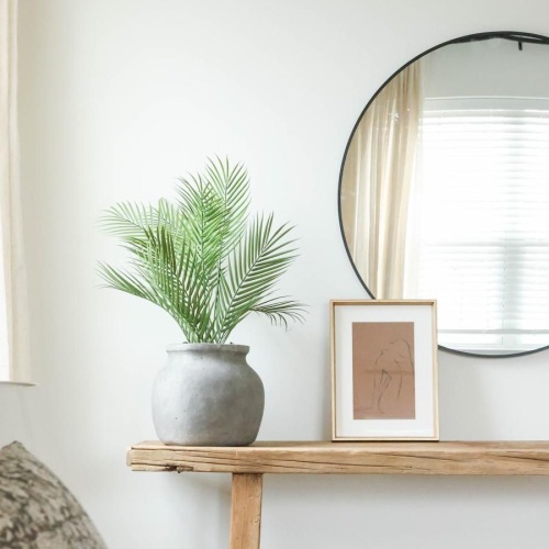 a bedroom with a mirror and natural lighting at 98 Penn Place in East Pennsboro Township, PA