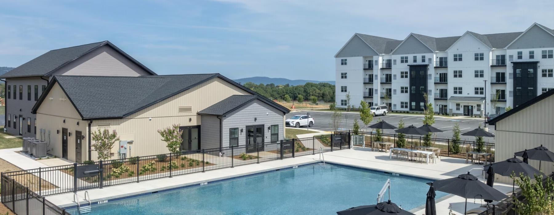 a swimming pool with a building in the background in East Pennsboro Township, PA