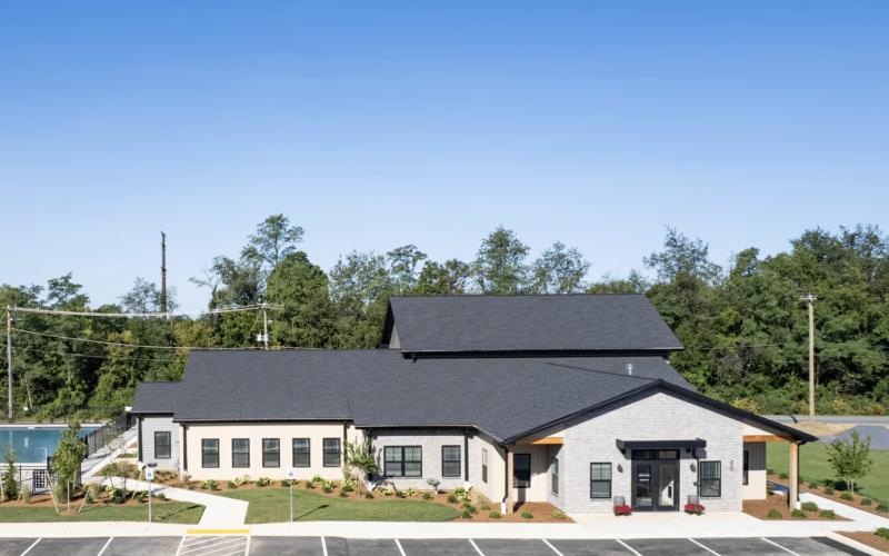 a leasing office and a pool surrounded by trees at 98 Penn Place in East Pennsboro Township, PA