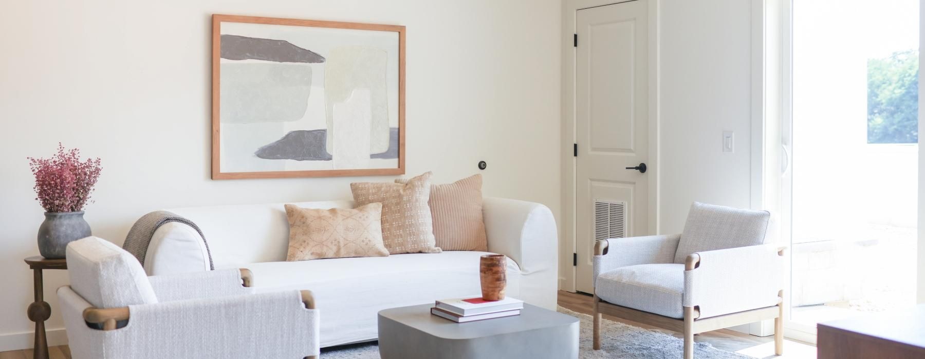 a living room with a couch and a rug and a large sliding glass door at 98 Penn Place in East Pennsboro Township, PA